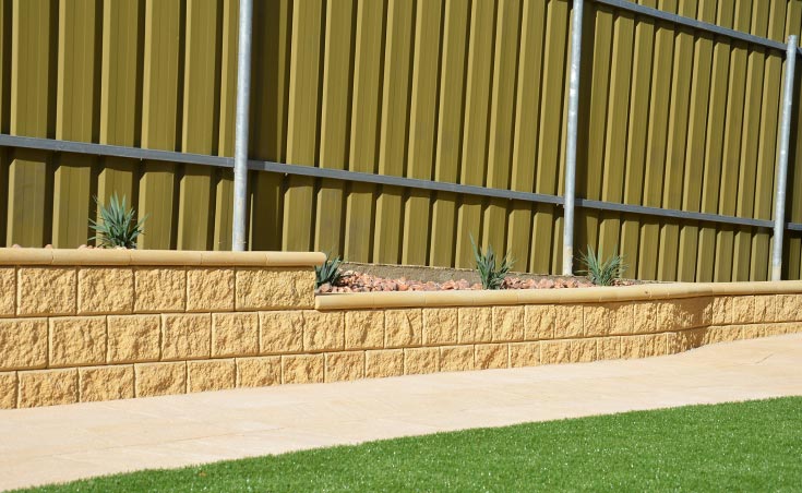 Concrete blocks used to retain gentle sloping back garden