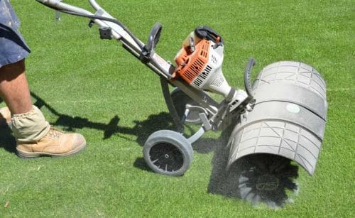 Run over the synthetic grass with a Power Brush